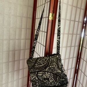 Vera Bradley cross body back. Faded and 4 corners worn, see pictures. Black,